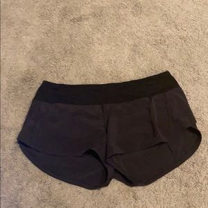 size 8 - lululemon black shorts - 4”